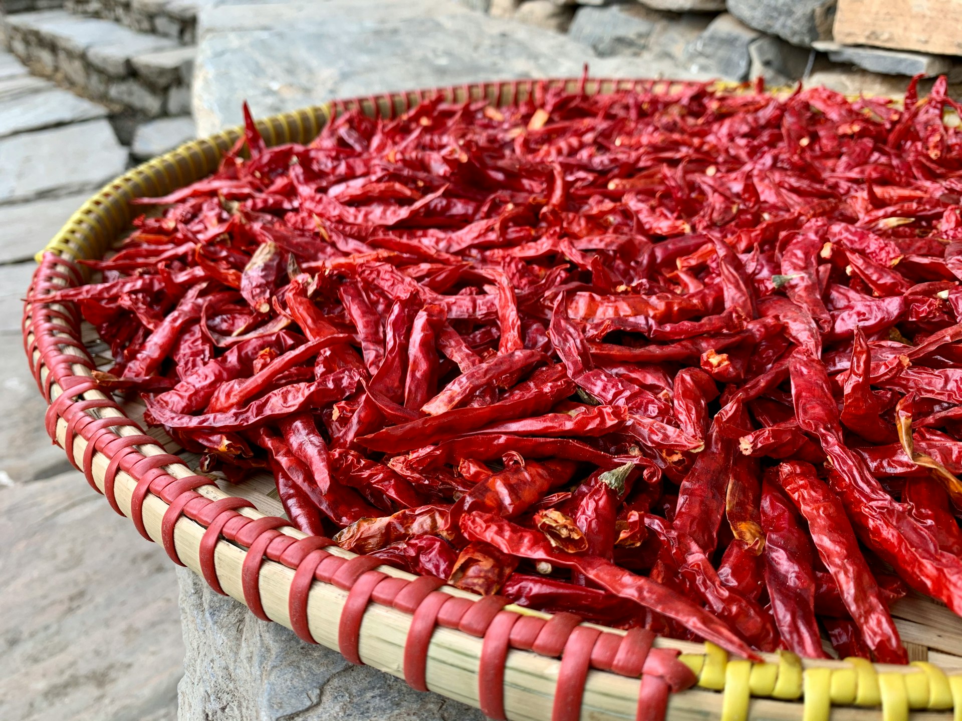 red chili on brown woven basket